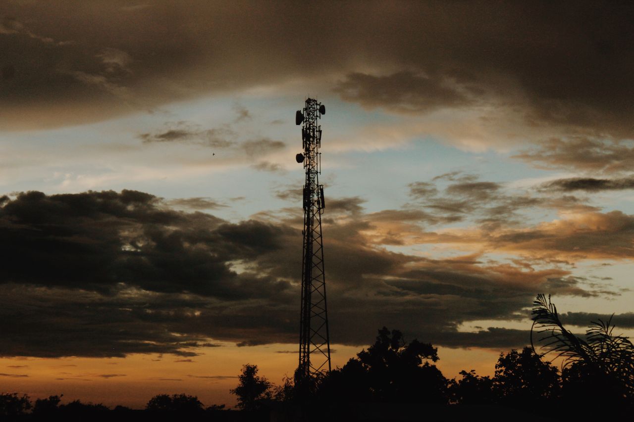 A striking silhouette of a cell tower against a dramatic sunset sky.